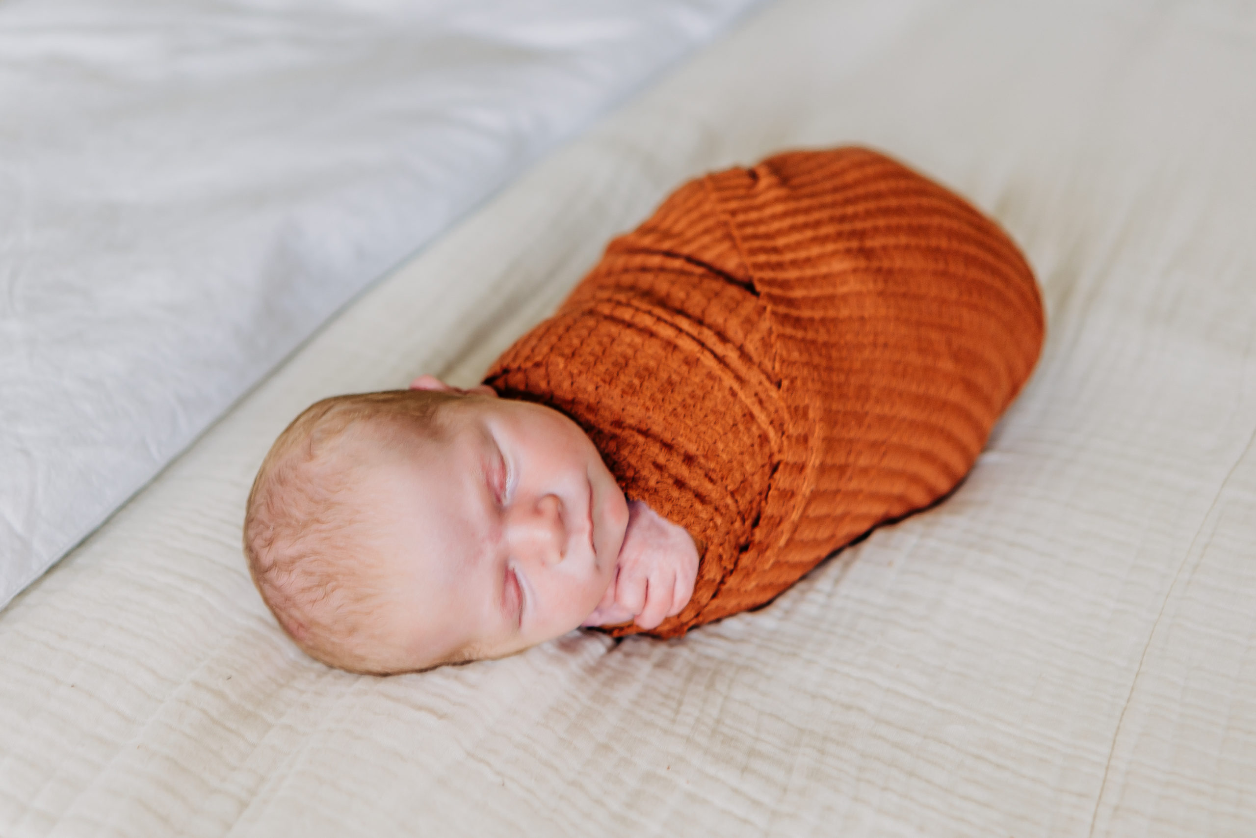 Baby in Orange Swaddle and Nursery in In-Home Newborn Session | In-Home Newborn and Family Session | Frisco, Texas Photographer | via brittnierenee.com