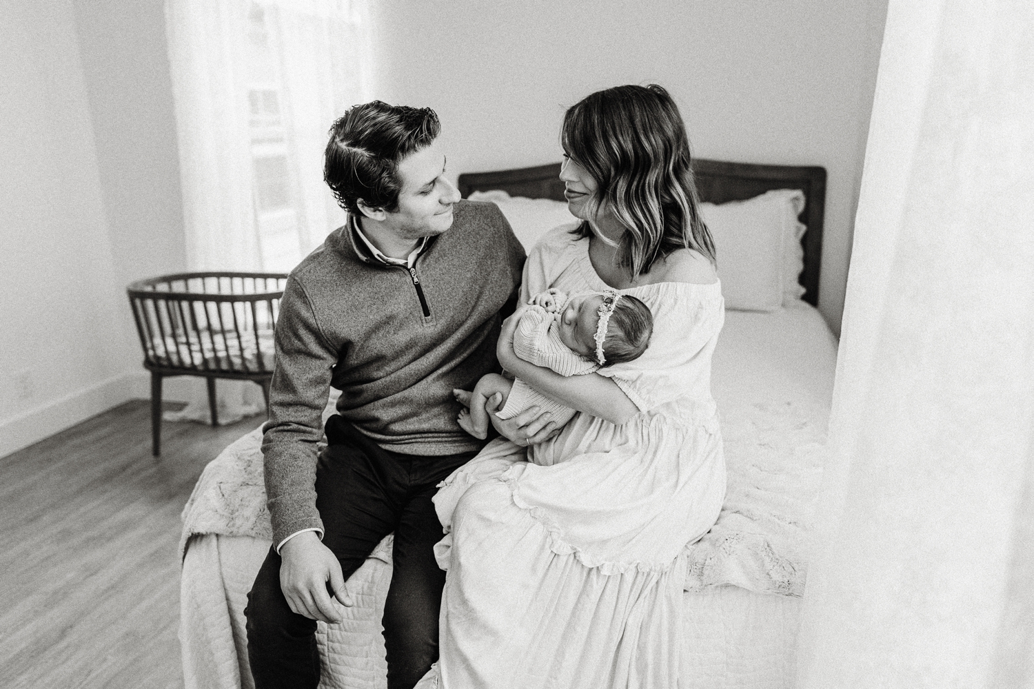 Mom and dad with newborn baby girl in candid family studio session in Dallas, Texas. | Dallas Family Photographer | Brittnie Renee Photo